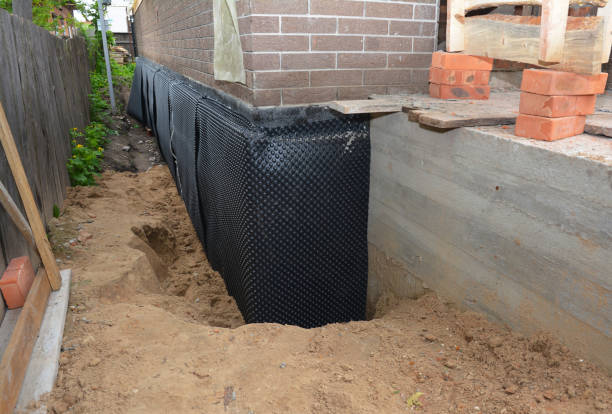 SJ Waterproofing Pros technician performing targeted Waterproofing assessment in Somerville, AL